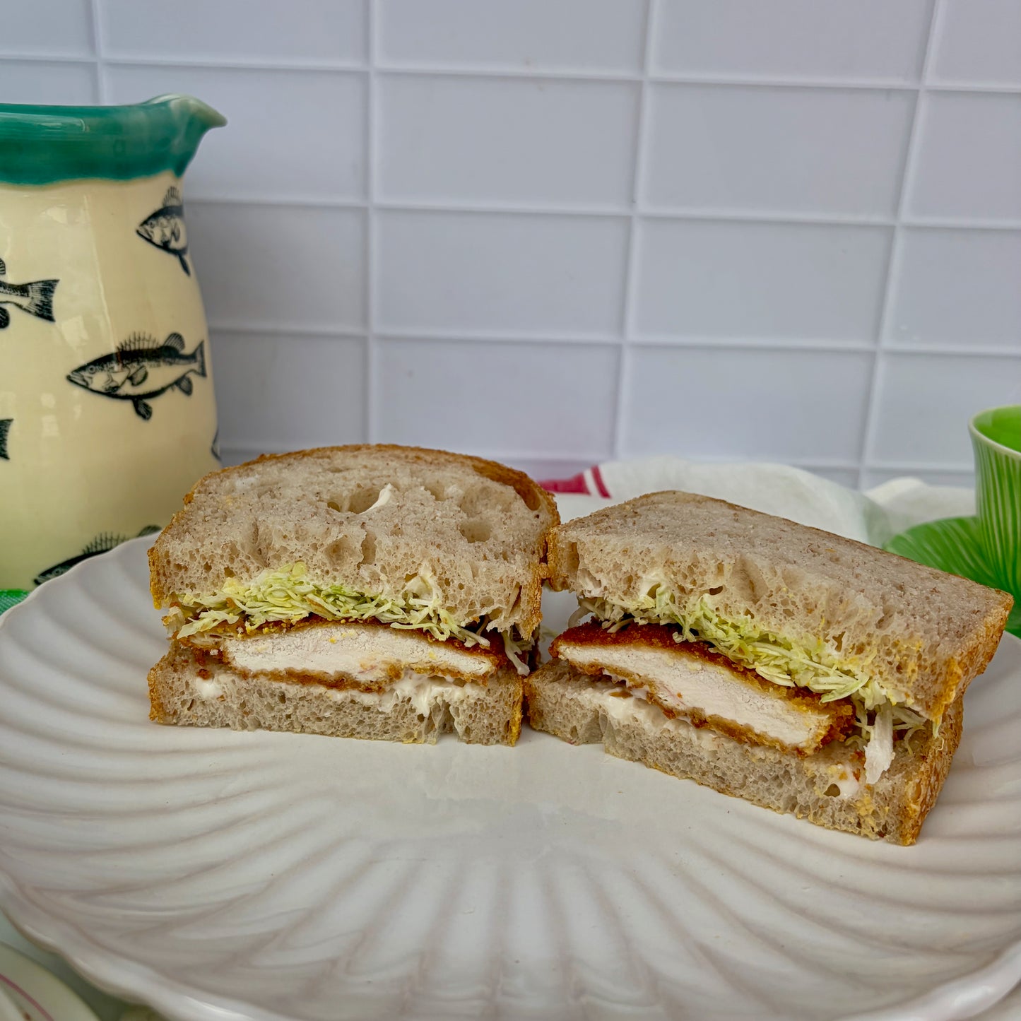 Katsu sando with crumbed katsu chicken and thinly sliced cabbage with mayo on sourdough