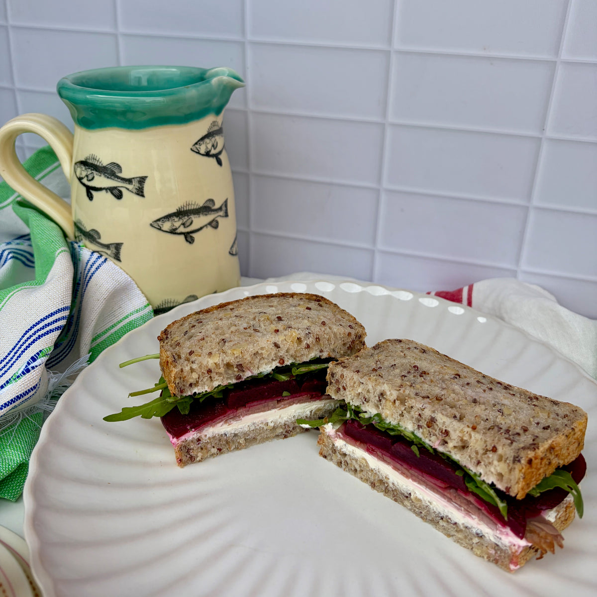 Beef + beetroot sandwich with cream cheese, roast beef, sliced beetroot and rocket