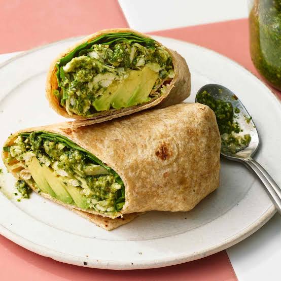 High protein chicken wrap with chicken, pesto, baby spinach + sliced avocado